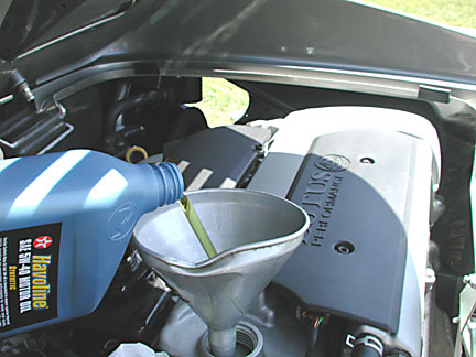 adding oil to a Lotus Elise